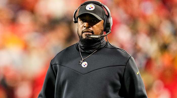 Steelers coach Mike Tomlin looks on.